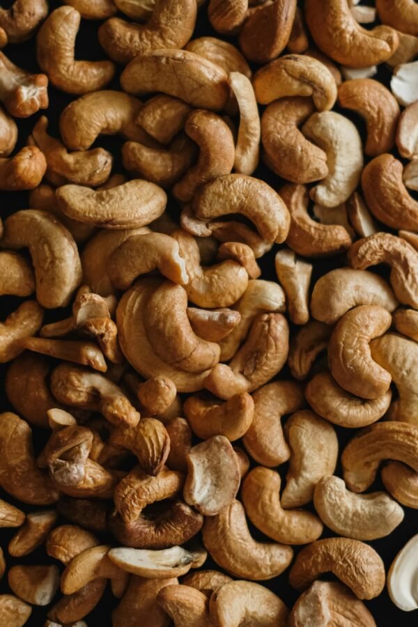 pexels-photo-18876240-18876240 High-quality close-up of roasted cashew nuts, perfect for food photography and culinary designs.